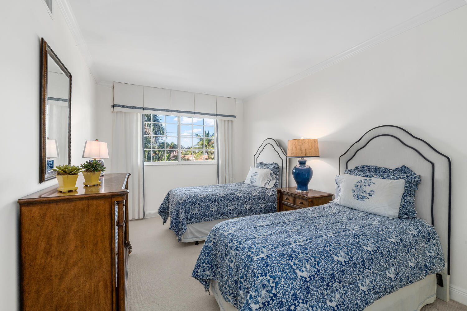 127 Peruvian Avenue, Unit 302 Palm Beach, FL 33480 - Photo 35 of 52 a bedroom with two beds and a dresser next to a window