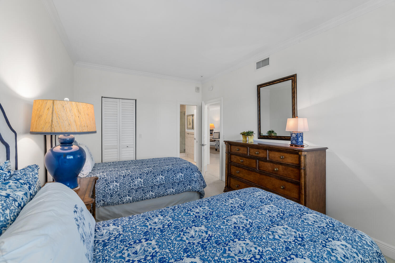 127 Peruvian Avenue, Unit 302 Palm Beach, FL 33480 - Photo 36 of 52 a bedroom with two bed and a dresser