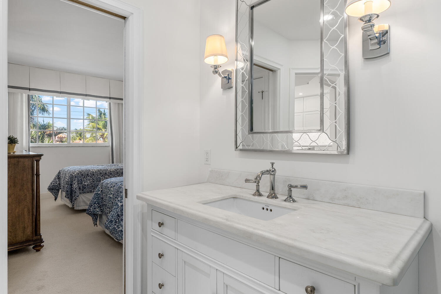 127 Peruvian Avenue, Unit 302 Palm Beach, FL 33480 - Photo 38 of 52 a en suite bathroom with a sink and mirror