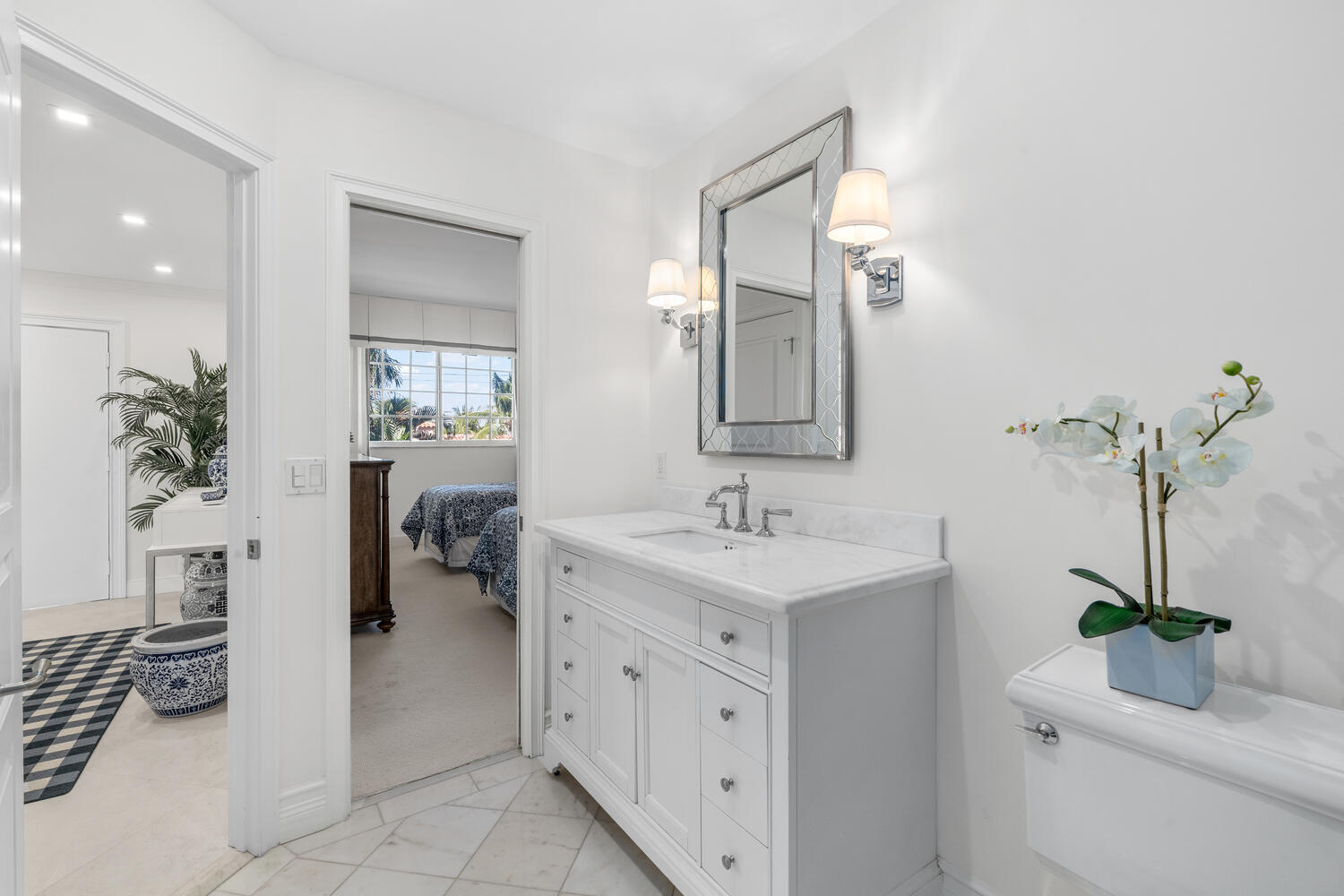 127 Peruvian Avenue, Unit 302 Palm Beach, FL 33480 - Photo 39 of 52 a en suite bathroom with a granite countertop sink and a mirror