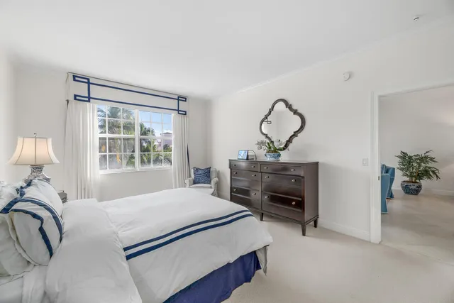 a bedroom with a bed and dresser