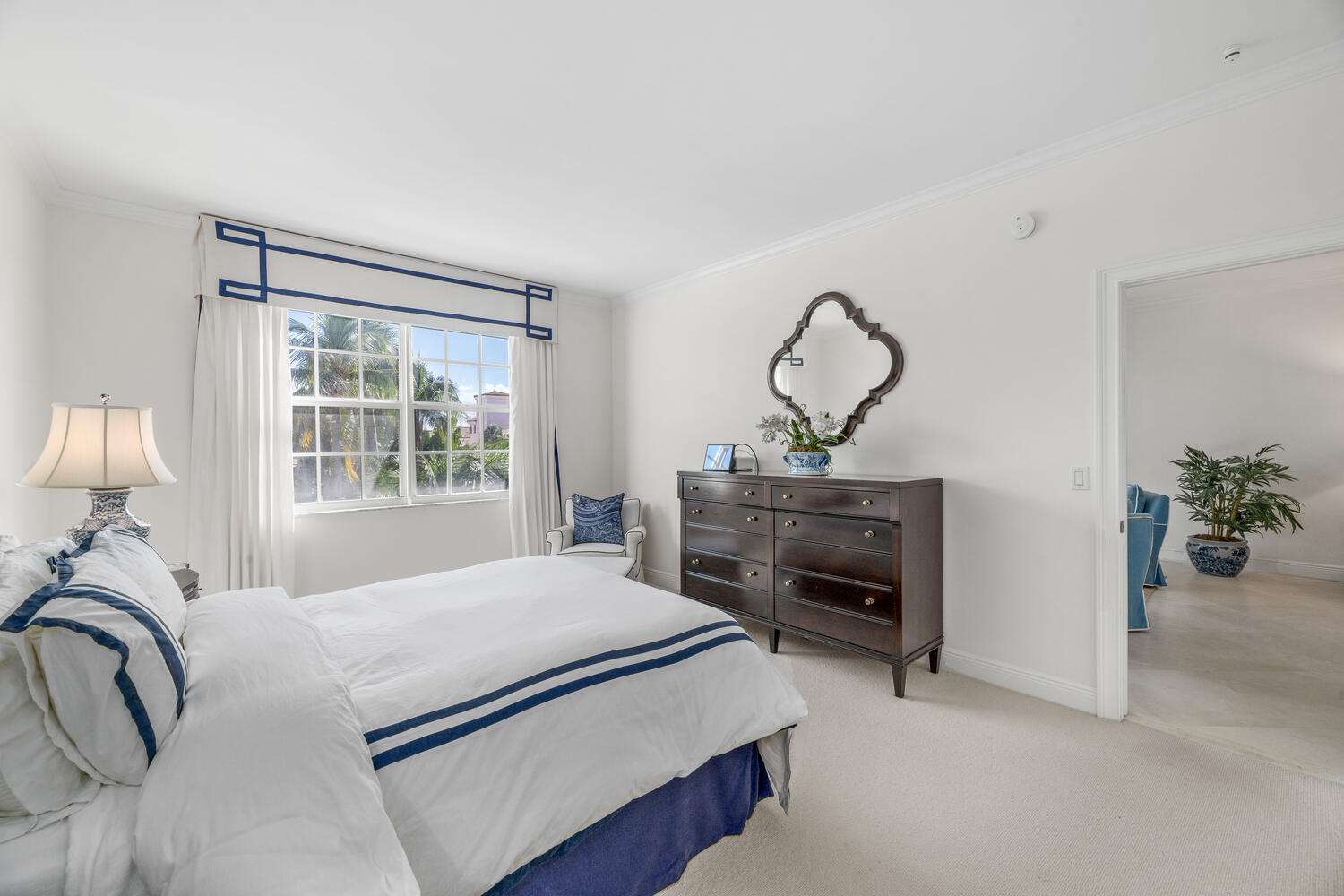 127 Peruvian Avenue, Unit 302 Palm Beach, FL 33480 - Photo 42 of 52 a bedroom with a bed and a chandelier