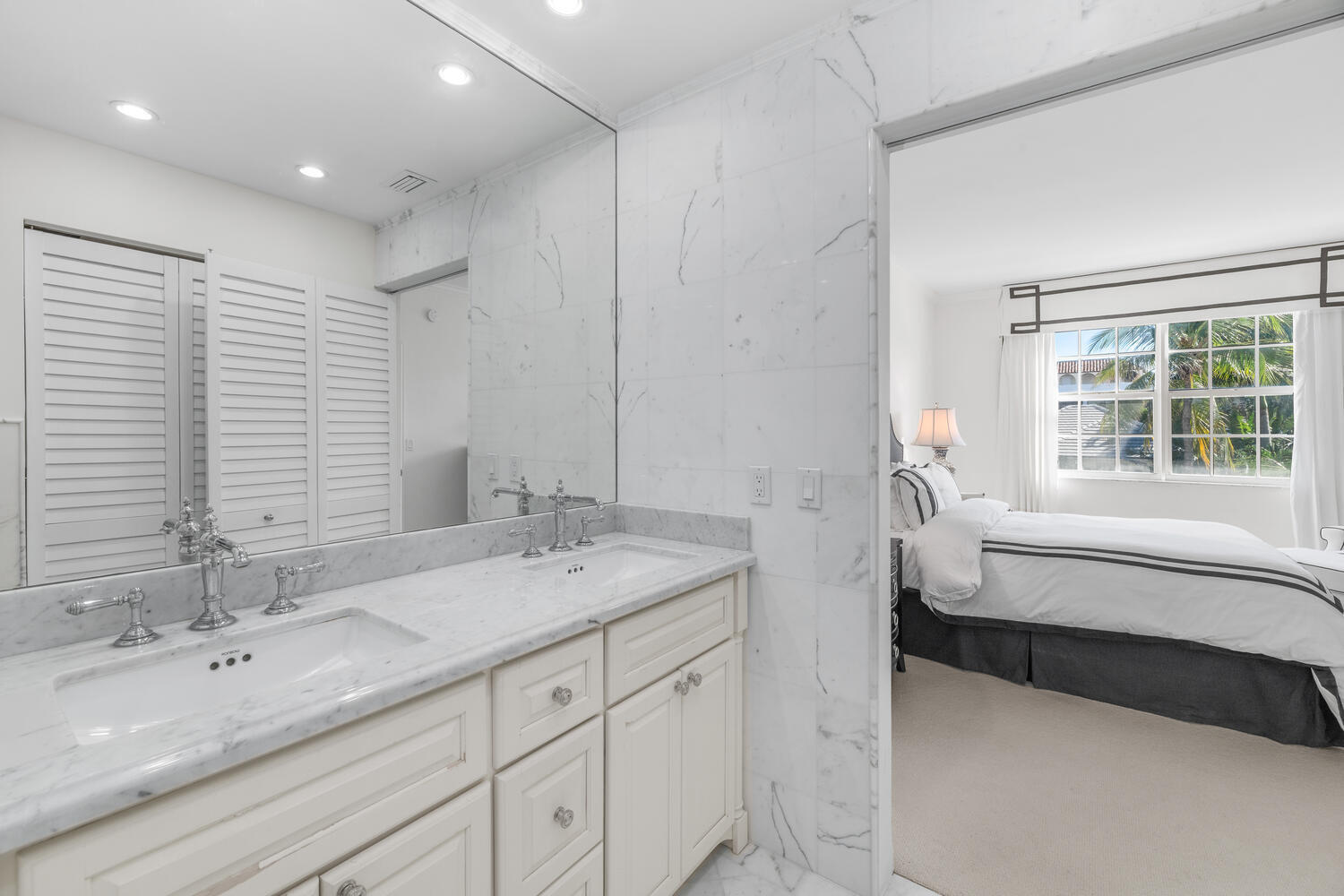 127 Peruvian Avenue, Unit 302 Palm Beach, FL 33480 - Photo 47 of 52 a spacious bathroom with a double vanity sink a mirror and a bathtub