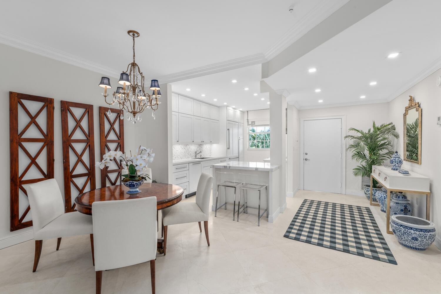 127 Peruvian Avenue, Unit 302 Palm Beach, FL 33480 - Photo 5 of 52 a room with furniture a chandelier and a rug