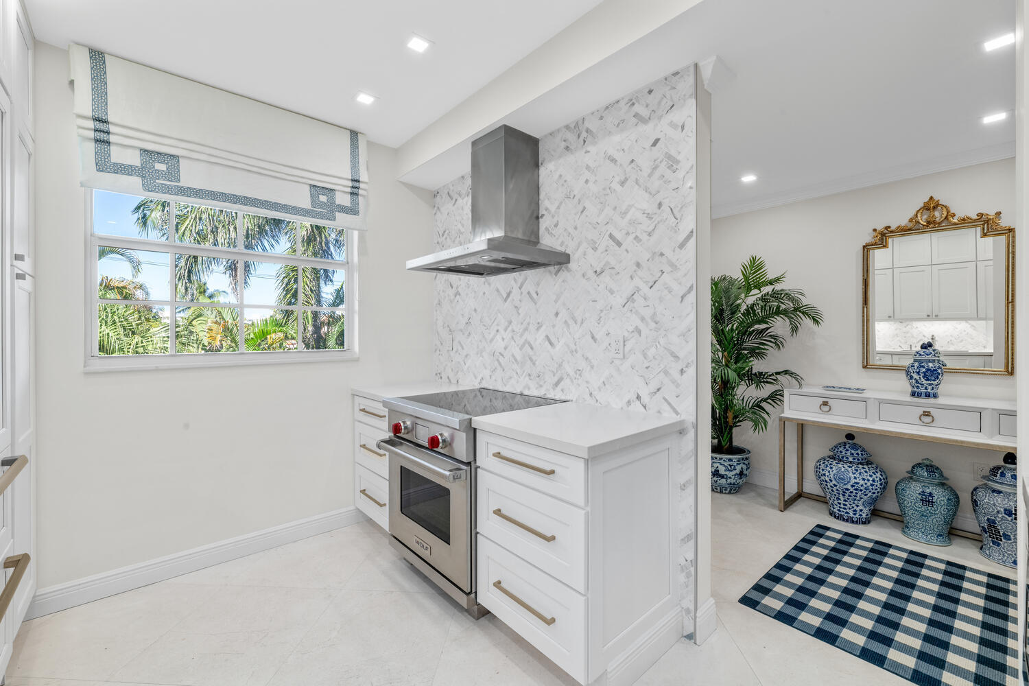 127 Peruvian Avenue, Unit 302 Palm Beach, FL 33480 - Photo 10 of 52 a kitchen with a stove and a sink