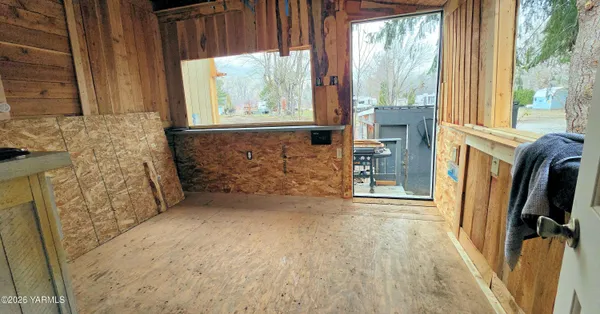 a view of livingroom with furniture and staircase