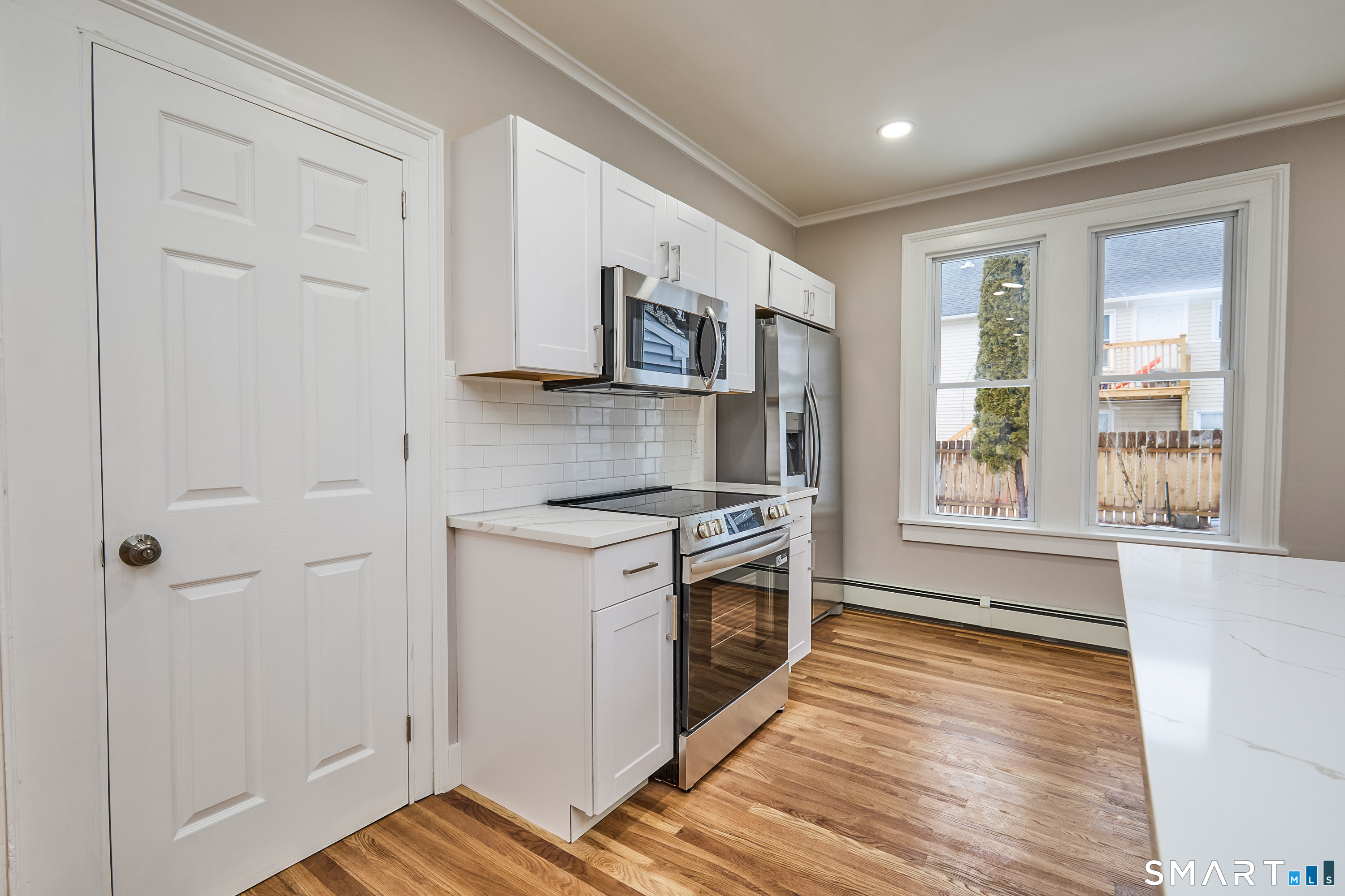 17 Grand Street Seymour, CT 06483 - Photo 13 of 40 a kitchen with stainless steel appliances granite countertop a stove and a refrigerator