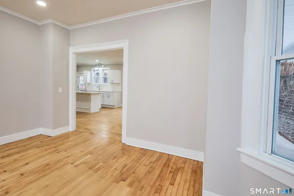 a view of an empty room with a window