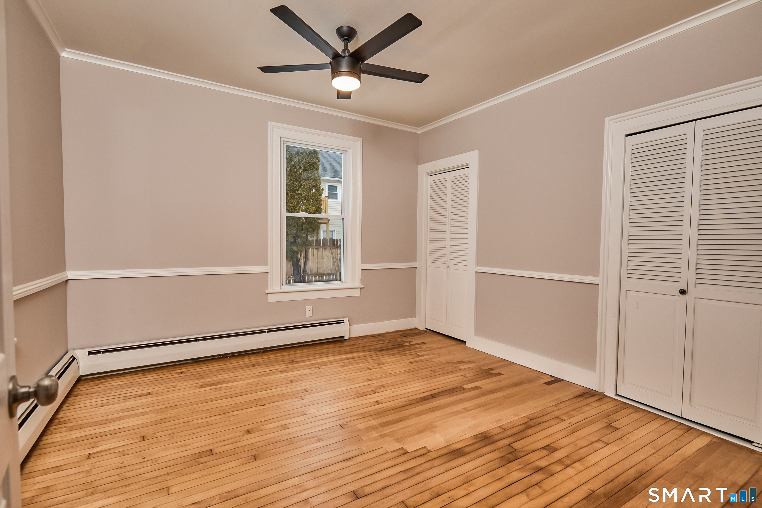 17 Grand Street Seymour, CT 06483 - Photo 26 of 40 a view of an empty room with wooden floor and a window