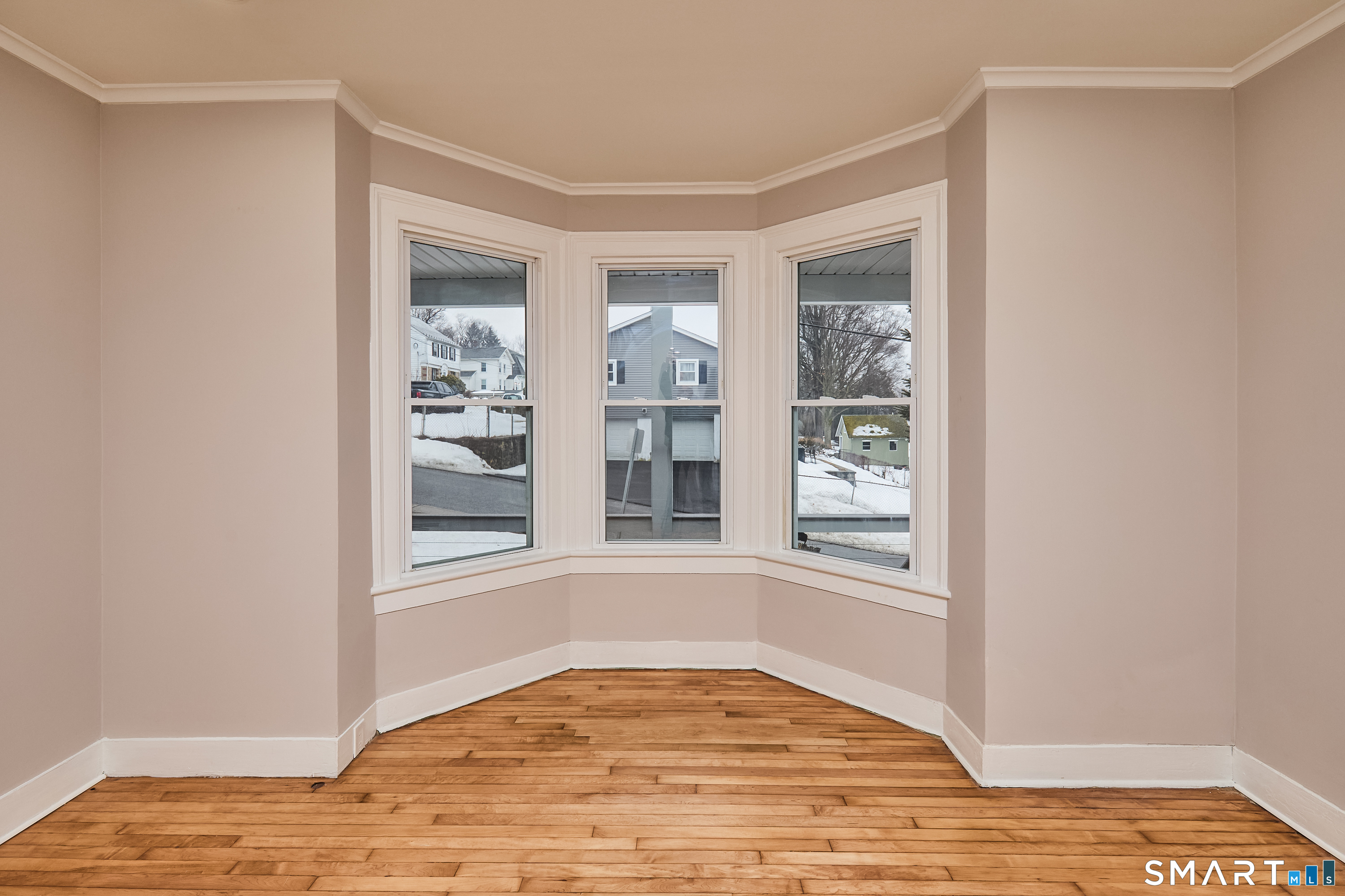 17 Grand Street Seymour, CT 06483 - Photo 30 of 40 a view of an empty room with wooden floor and a window
