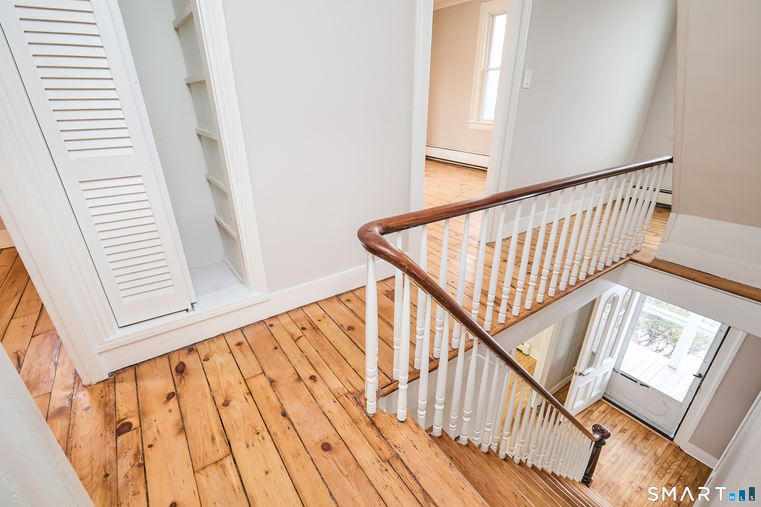 17 Grand Street Seymour, CT 06483 - Photo 33 of 40 a view of entryway with wooden floor and stairs