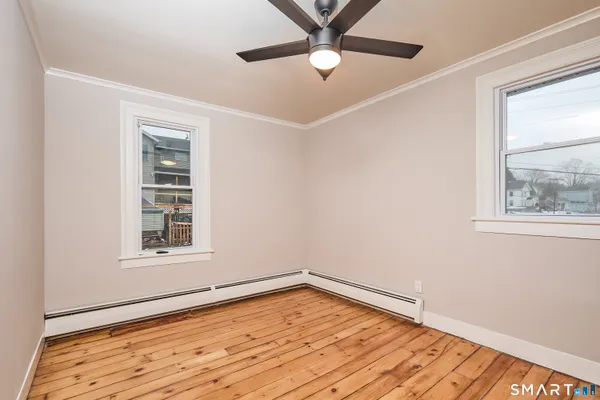 a view of entryway with wooden floor and stairs
