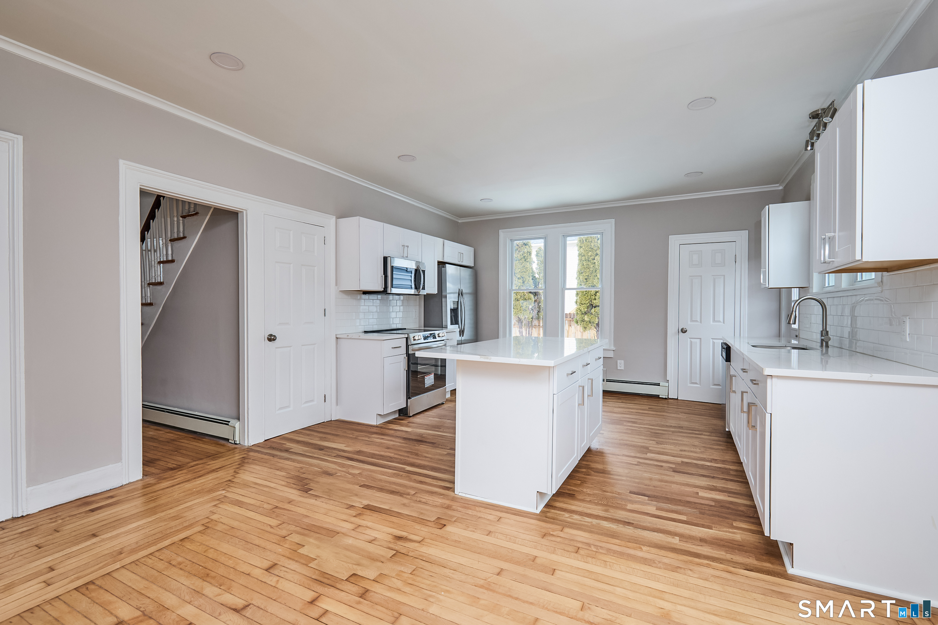17 Grand Street Seymour, CT 06483 - Photo 9 of 40 a kitchen with white cabinets and sink