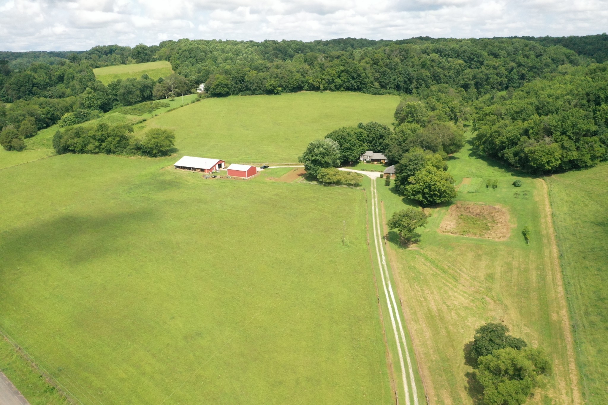2058 Bodenham Road Pulaski, TN 38478 - Photo 1 of 38 a view of a lake with a mountain in the back
