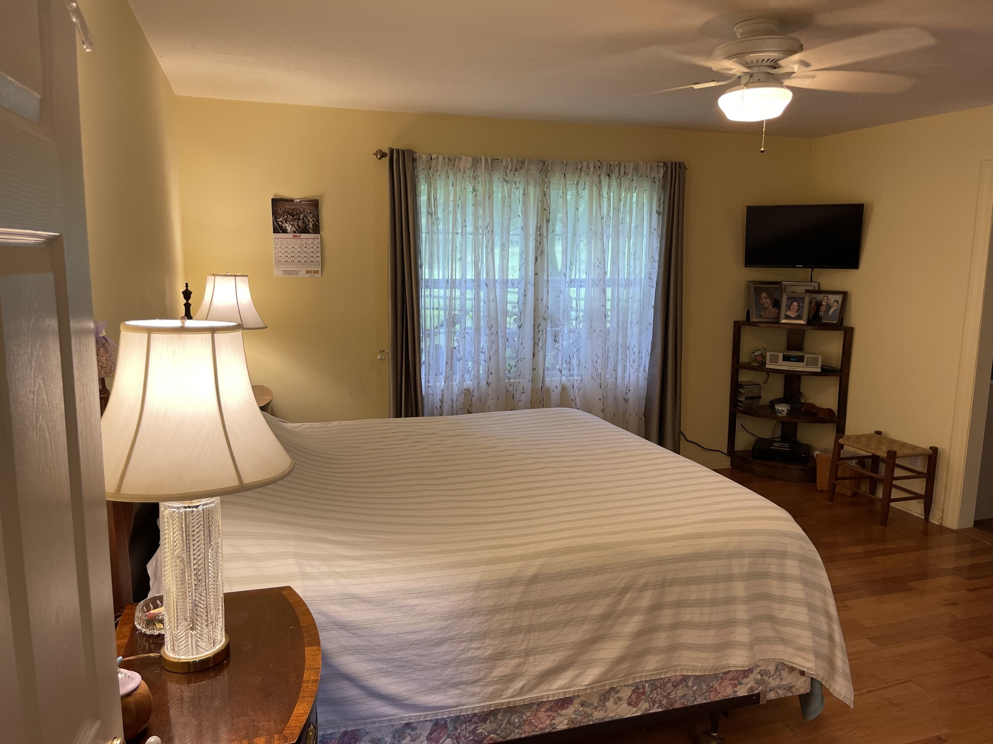 2058 Bodenham Road Pulaski, TN 38478 - Photo 18 of 38 a bedroom with a bed and a chandelier