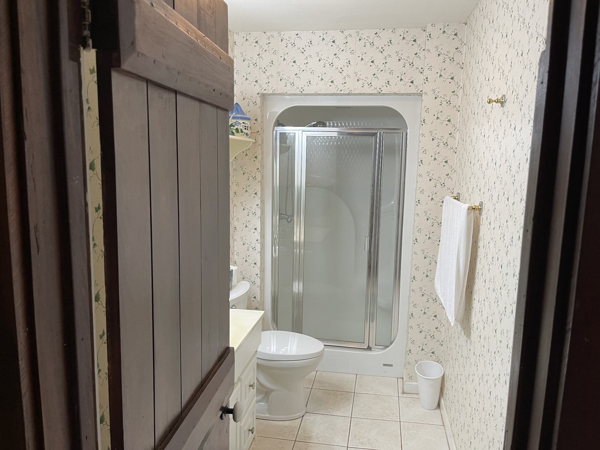 2058 Bodenham Road Pulaski, TN 38478 - Photo 21 of 38 a bathroom with a granite countertop shower a mirror and a toilet
