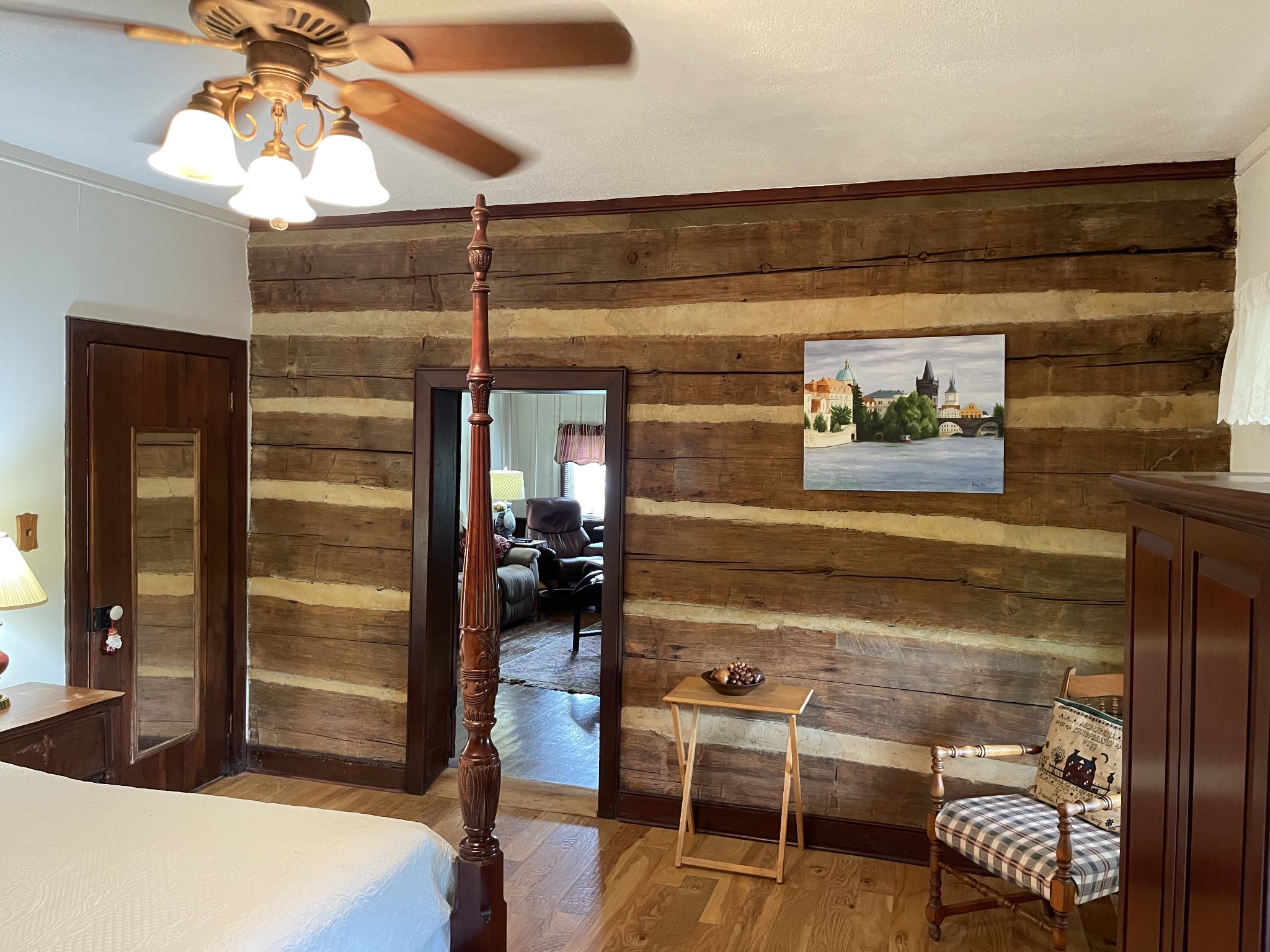 2058 Bodenham Road Pulaski, TN 38478 - Photo 23 of 38 a bedroom with a bed and a chandelier