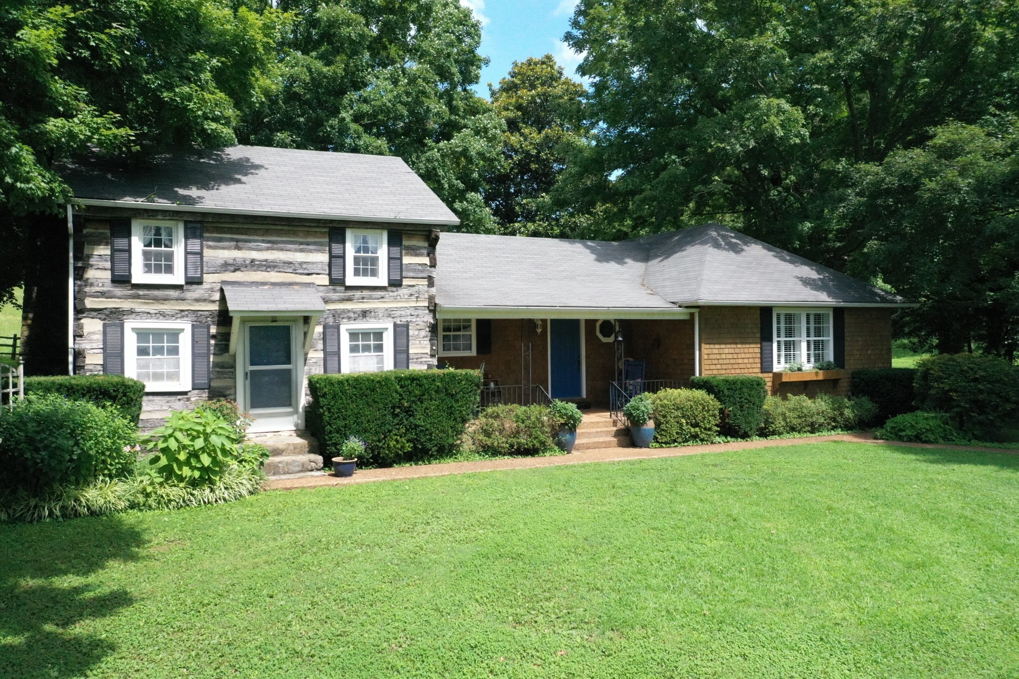 2058 Bodenham Road Pulaski, TN 38478 - Photo 4 of 38 a front view of a house with a yard and garage