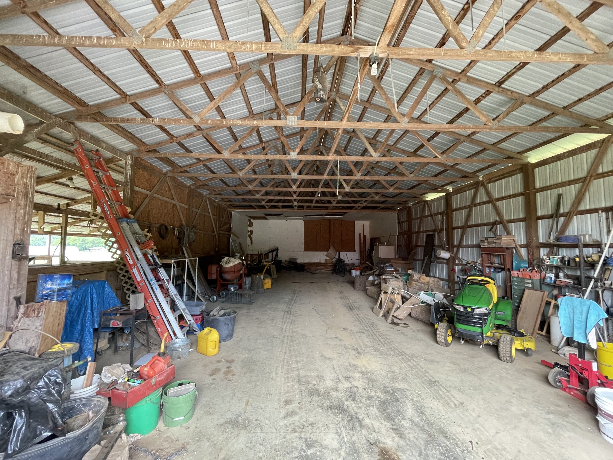 2058 Bodenham Road Pulaski, TN 38478 - Photo 34 of 38 a view of a storage room with a lot of stuff