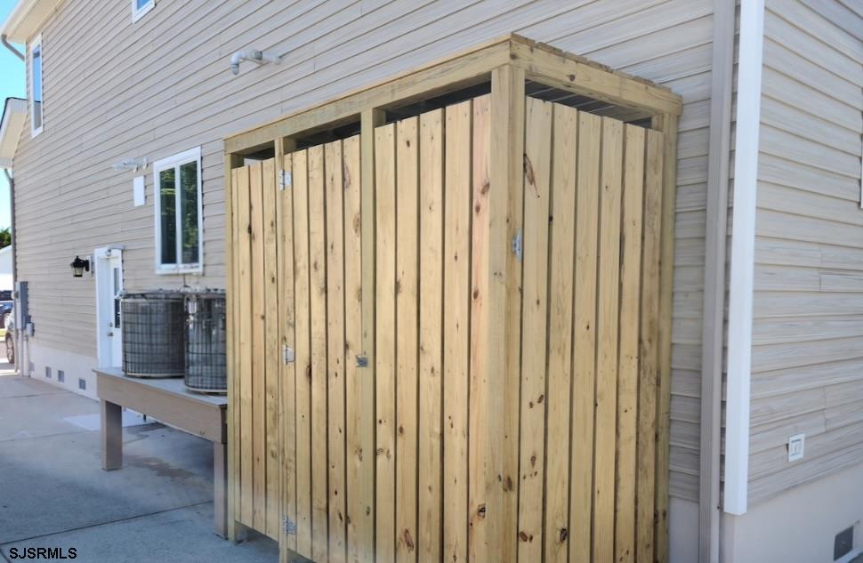 16 Collette Circle Brigantine, NJ 08203 - Photo 11 of 13 a view of a porch with a table and chairs