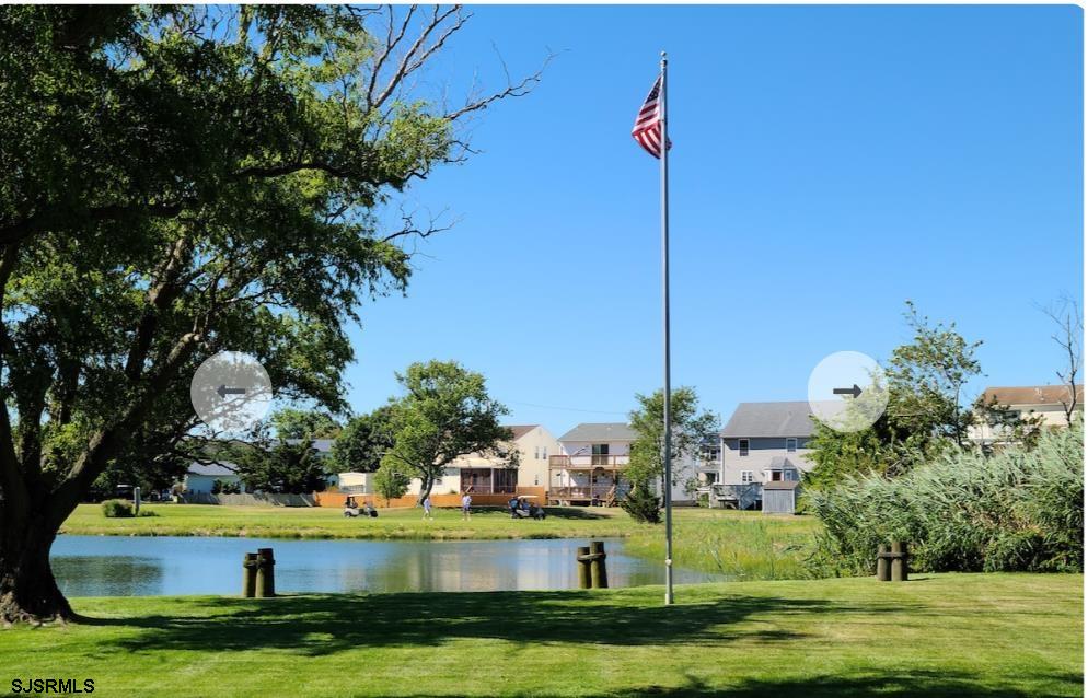 16 Collette Circle Brigantine, NJ 08203 - Photo 4 of 13 a view of a house with a big yard and potted plants