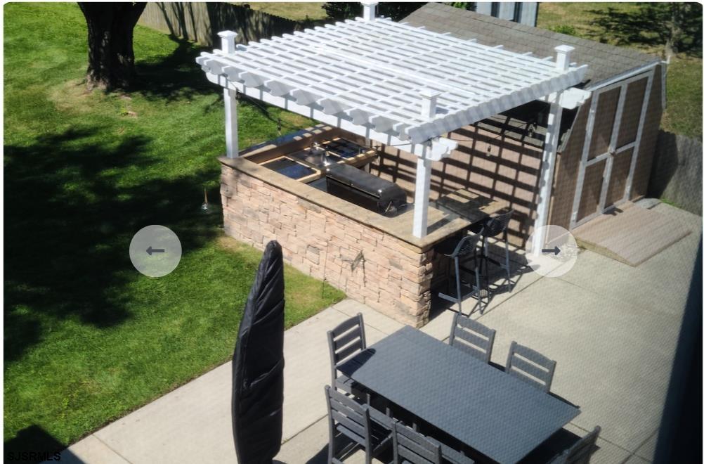 16 Collette Circle Brigantine, NJ 08203 - Photo 9 of 13 an aerial view of a house with backyard and garden