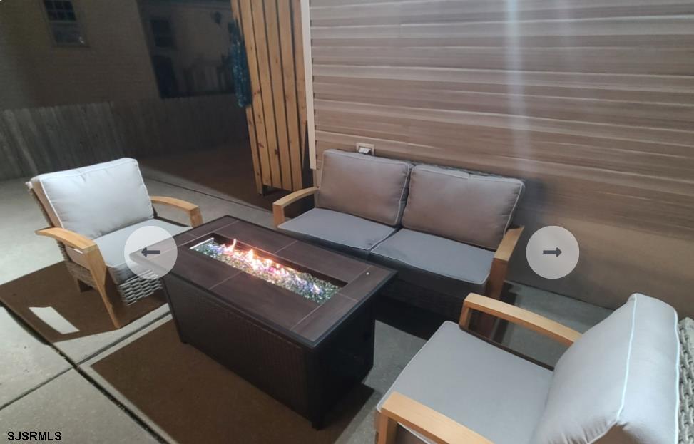 16 Collette Circle Brigantine, NJ 08203 - Photo 10 of 13 a living room with furniture and a fireplace