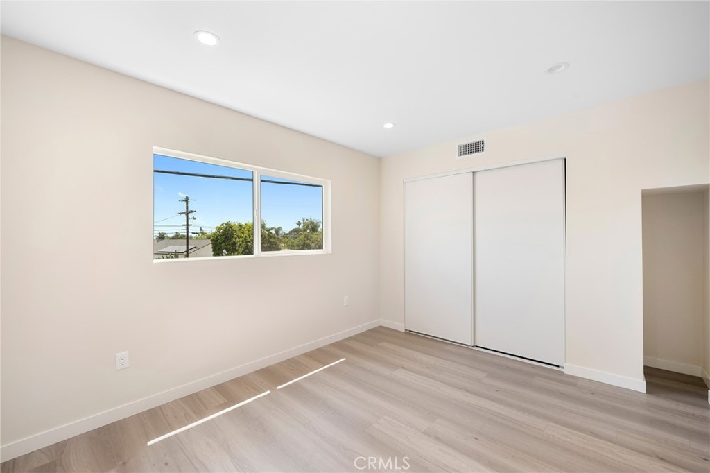 8435 Rincon Avenue Sun Valley, CA 91352 - Photo 48 of 61 a view of an empty room with wooden floor and a window