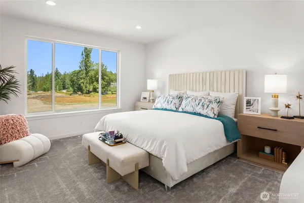 a bedroom with a bed and a couch