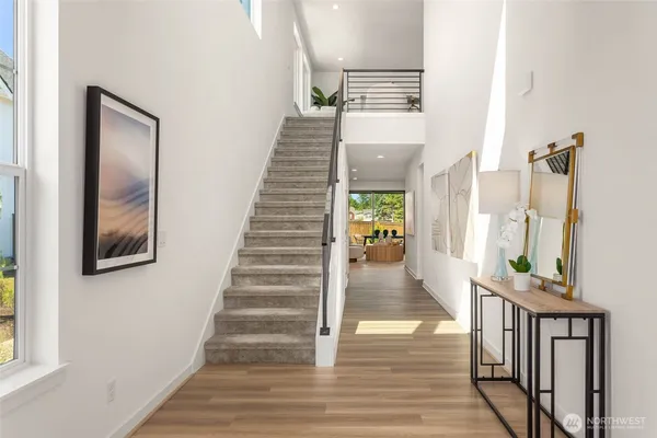 a view of an entryway with wooden floor