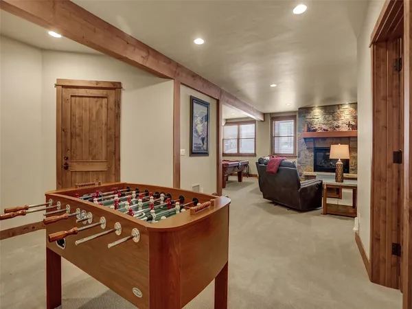 a kitchen with sink stove and refrigerator