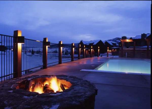 a view of a swimming pool with an outdoor seating