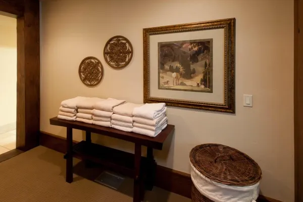 a view of a room that has a table and a chair