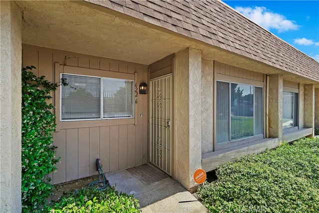 front view of a house with a small yard