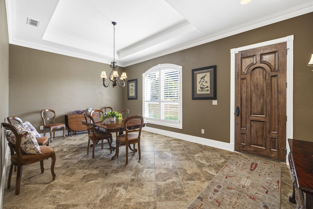 150 St Andrews Loop Kerrville, TX 78028 - Photo 3 of 27 a dining room with furniture and window