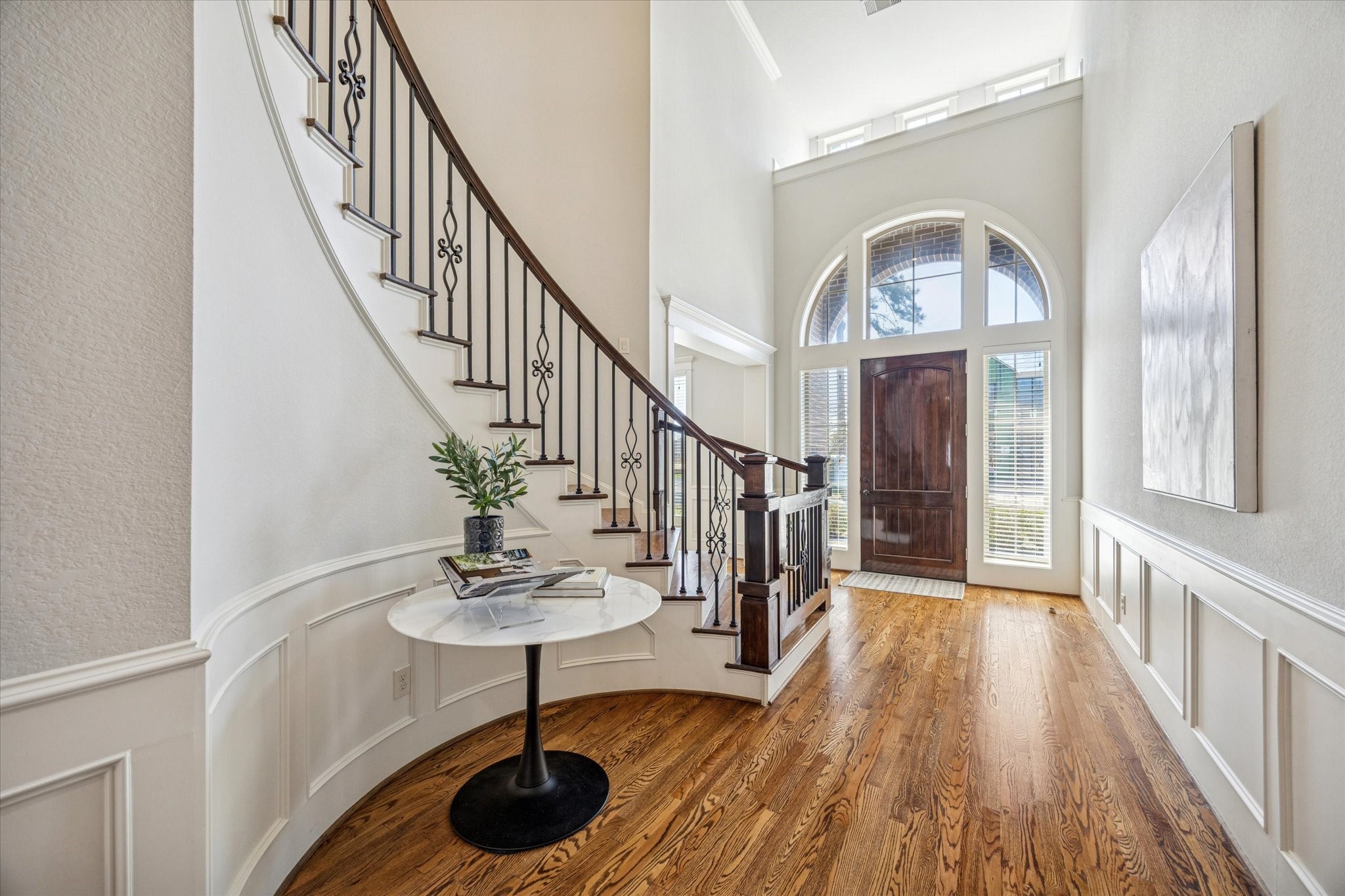 1802 Wakefield Drive Houston, TX 77018 - Photo 8 of 47 Foyer detail featuring refined finishes and the graceful curve of the staircase.