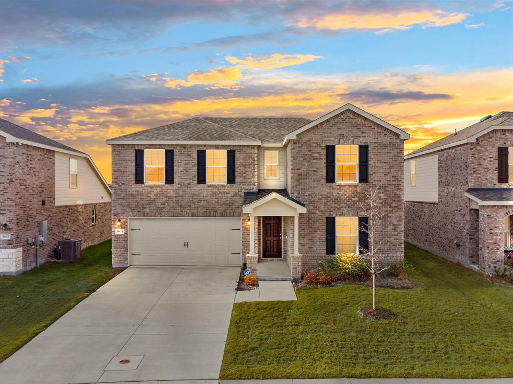 1605 Timpson Drive Forney, TX 75126 - Photo 1 of 1 front view of house with a yard