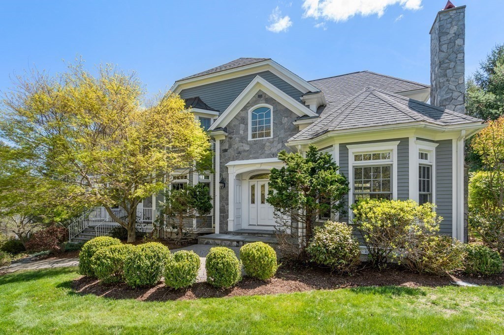 a front view of a house with garden