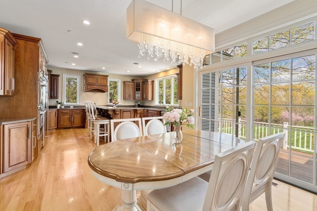 74 Carter Drive Framingham, MA 01701 - Photo 11 of 23 a dining room with furniture a chandelier and wooden floor