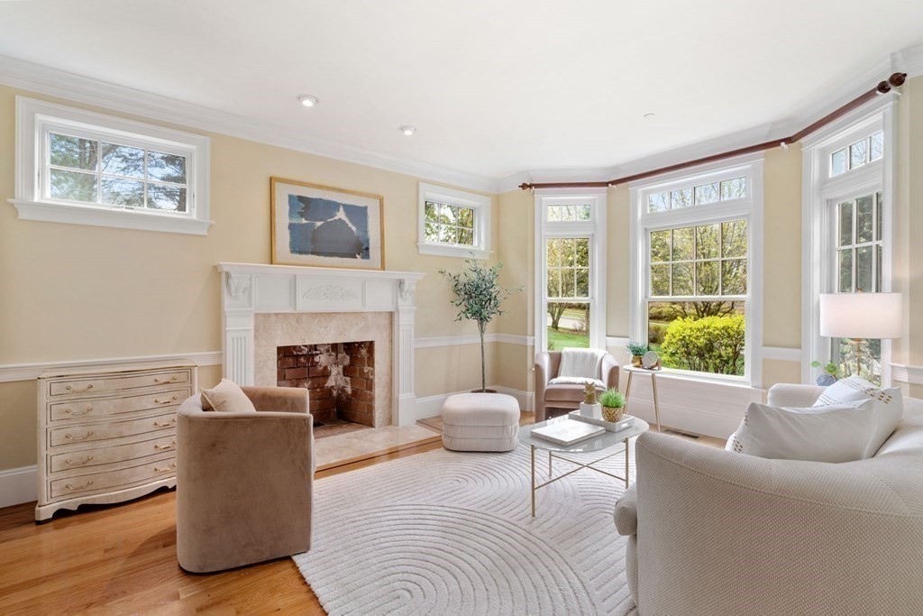 74 Carter Drive Framingham, MA 01701 - Photo 13 of 23 a living room with furniture and a fireplace