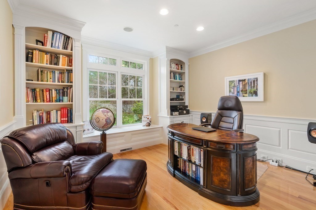 74 Carter Drive Framingham, MA 01701 - Photo 15 of 23 a living room with furniture and a book shelf