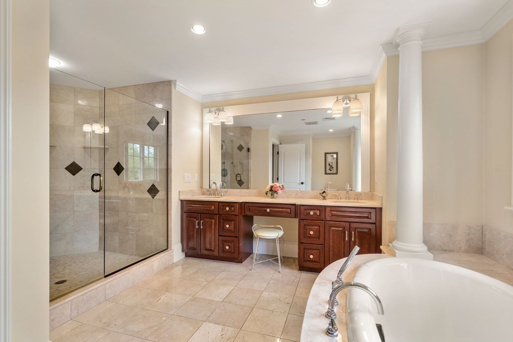 74 Carter Drive Framingham, MA 01701 - Photo 17 of 23 a spacious bathroom with a granite countertop tub sink shower and mirror