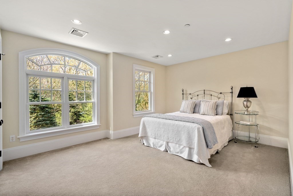 74 Carter Drive Framingham, MA 01701 - Photo 19 of 23 a spacious bedroom with a large bed and a large window
