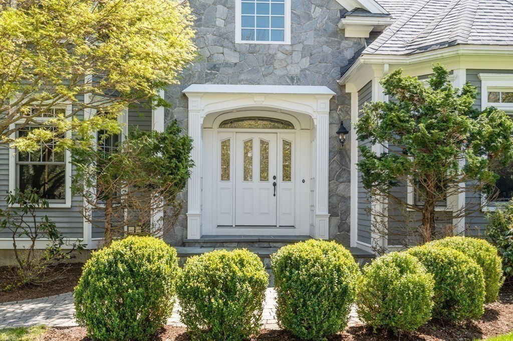 74 Carter Drive Framingham, MA 01701 - Photo 21 of 23 a front view of a house with a lots of green space