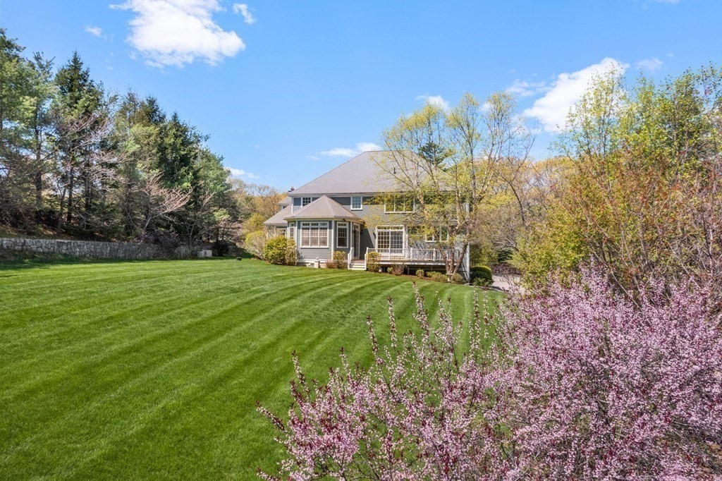74 Carter Drive Framingham, MA 01701 - Photo 3 of 23 a view of a house with a big yard
