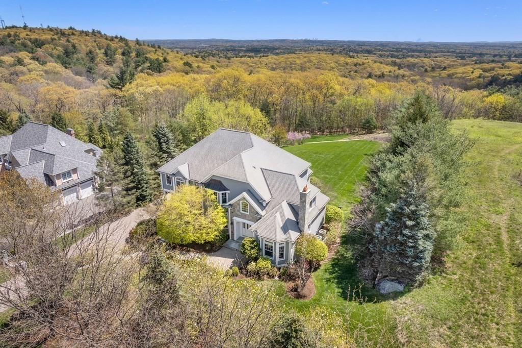 74 Carter Drive Framingham, MA 01701 - Photo 4 of 23 an aerial view of a house with a garden