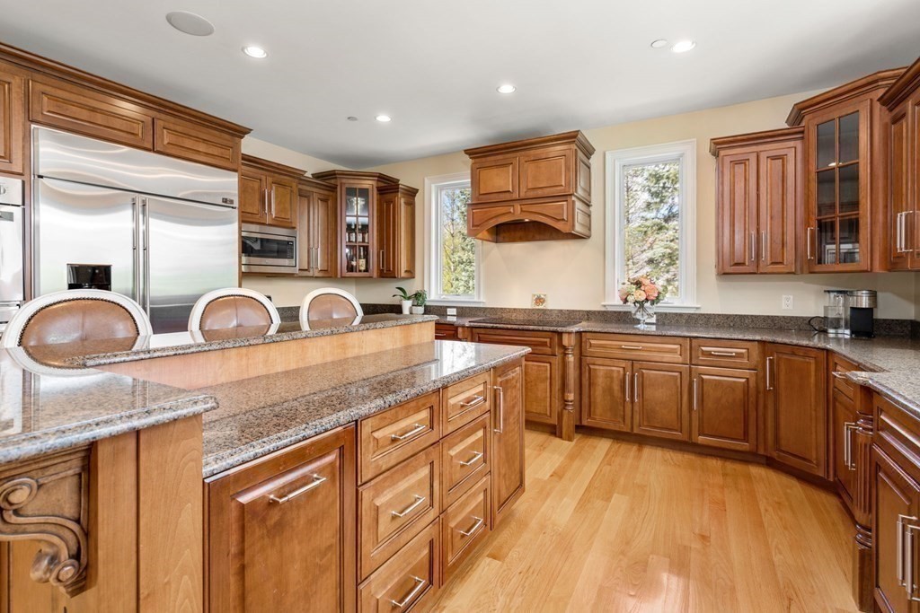 74 Carter Drive Framingham, MA 01701 - Photo 9 of 23 a kitchen with granite countertop a sink and cabinets
