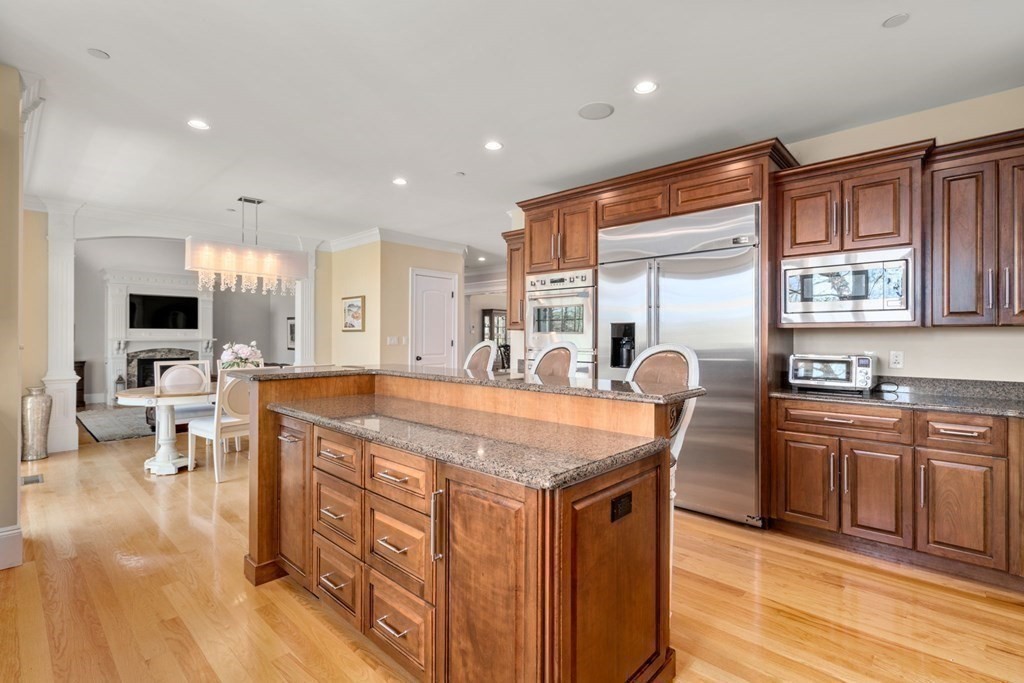 74 Carter Drive Framingham, MA 01701 - Photo 10 of 23 a large kitchen with stainless steel appliances a large counter top