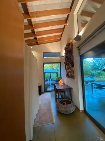 a view of backyard with outdoor seating and trees