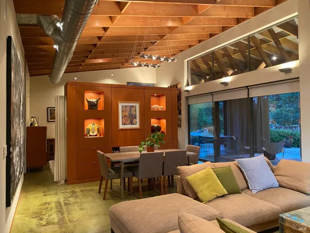 a room with musical instrument table and chairs